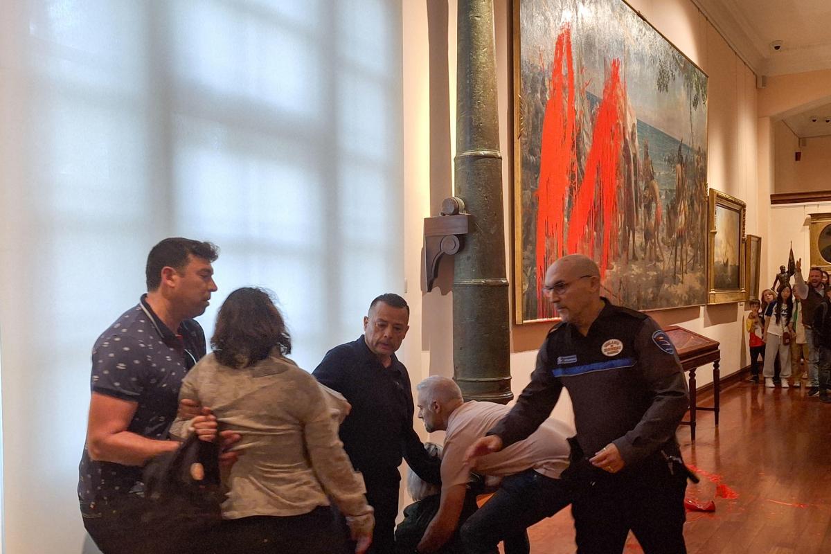 dos activistas del movimiento futuro vegetal han lanzado este domingo pintura roja biodegradable sobre un cuadro en el museo naval de madrid